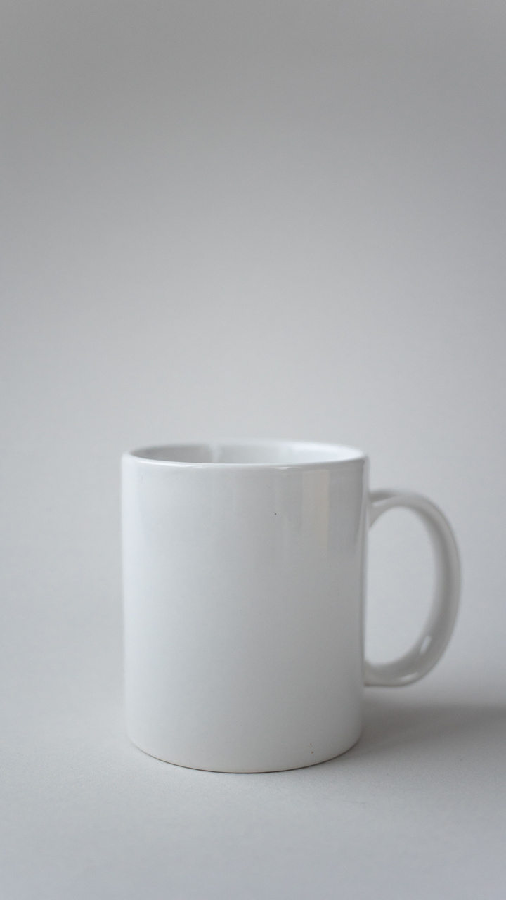 Four-second vertical AI rotation video generated from one white ceramic mug photo